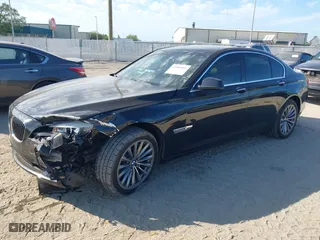 2012 BMW 7 Series 740i with VIN WBAKA4C51CC613636, listed as a IAAI auction lot 41908801 with 127,725 mi miles. Bid and sale history available at carsss.com. Image 2.