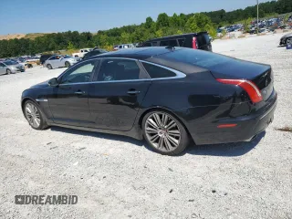 2014 Jaguar XJ Portfolio with VIN SAJWA2GZ2E8V66906, listed as a Copart auction lot 64888135 with 166,194 mi miles and Clean title. Bid and sale history available at DreamBid. Image 2.