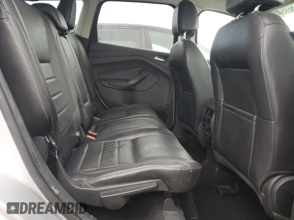 2016 Ford Escape SE z VIN 1FMCU0G91GUC59990, wystawiony jako Copart lot #56956395 z przebiegiem 112 706 mil mil oraz Szkoda całkowita • Salvage title. Historia ofert i sprzedaży dostępna na DreamBid. Obrazek 11.