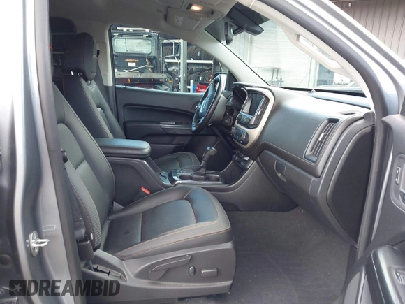 2021 GMC Canyon 4WD AT4 z VIN 1GTG6FEN8M1275345, wystawiony jako IAAI lot #42045878 z przebiegiem 68 299 mil mil oraz . Historia ofert i sprzedaży dostępna na DreamBid. Obrazek 5.