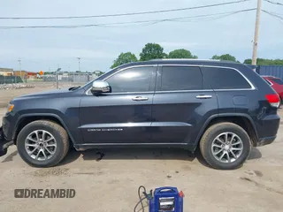 2014 Jeep Grand Cherokee Limited z VIN 1C4RJFBG0EC365866, wystawiony jako IAAI lot #42542796 z przebiegiem 165 511 mil mil oraz . Historia ofert i sprzedaży dostępna na DreamBid. Obrazek 14.
