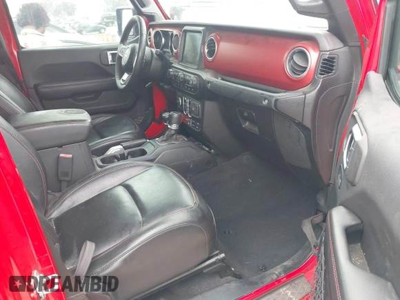 2020 Jeep Gladiator Rubicon with VIN 1C6JJTBG4LL178260, listed as a IAAI auction lot 42602460 with 61,899 mi miles and . Bid and sale history available at DreamBid. Image 5.