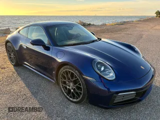 2021 Porsche 911 Carrera with VIN WP0AA2A99MS205658, listed as a Copart auction lot 87132364 with 33,195 mi miles and Salvage Title. Bid and sale history available at carsss.com. Image 1.