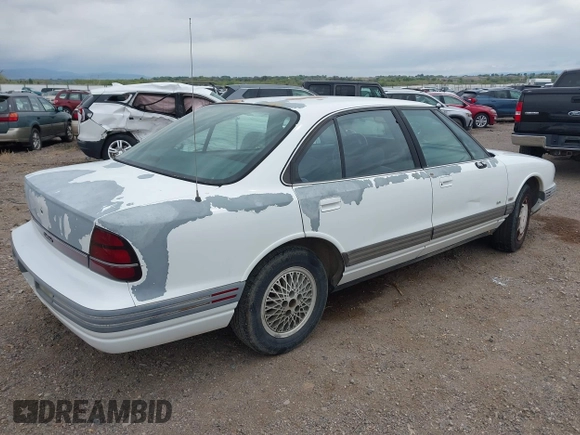 1993 Oldsmobile 88 z VIN 1G3HN53L0PH312824, wystawiony jako IAAI lot #42200714 z przebiegiem 152 810 mil mil oraz . Historia ofert i sprzedaży dostępna na DreamBid. Obrazek 4.
