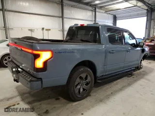 2023 Ford F-150 Lightning Pro with VIN 1FT6W1EV4PWG47236, listed as a Copart auction lot 43584015 with 15,411 mi miles and Salvage Title. Bid and sale history available at carsss.com. Image 3.