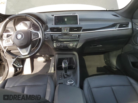 2020 BMW X1 xDrive28i with VIN WBXJG9C06L5P89796, listed as a Copart auction lot 52817235 with 95,665 mi miles and Salvage title. Bid and sale history available at DreamBid. Image 8.