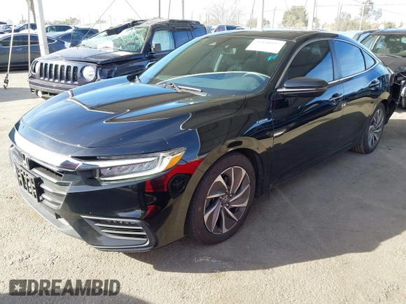 2020 Honda Insight Touring with VIN 19XZE4F91LE010778, listed as a IAAI auction lot 41430937 with 29,454 mi miles and . Bid and sale history available at carsss.com. Image 2.