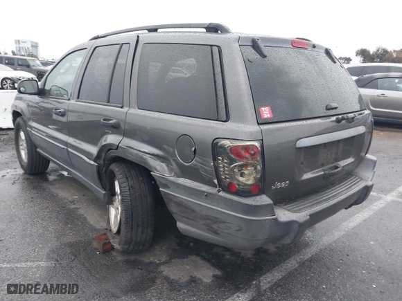 2004 Jeep Grand Cherokee Laredo with VIN 1J4GX48S14C177923, listed as a IAAI auction lot 41745772 with 242,506 mi miles. Bid and sale history available at carsss.com. Image 3.