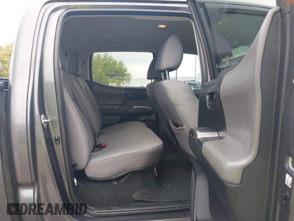 2018 Toyota Tacoma SR5 with VIN 5TFAZ5CN5JX062498, listed as a IAAI auction lot 41867393 with 128,879 mi miles and . Bid and sale history available at DreamBid. Image 8.