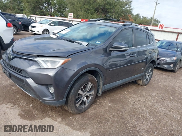 2018 Toyota RAV4 XLE with VIN 2T3WFREV4JW417555, listed as a IAAI auction lot 41092589 with 93,788 mi miles and . Bid and sale history available at DreamBid. Image 2.
