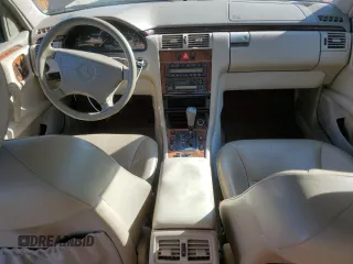 1998 Mercedes-Benz E 320 with VIN WDBJF25FXWA549962, listed as a Copart auction lot 87876005 with 303,884 mi miles and Salvage Title. Bid and sale history available at DreamBid. Image 8.
