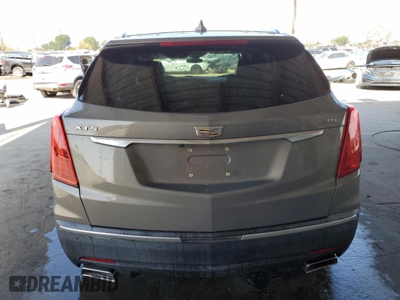 2019 Cadillac XT5 Luxury FWD z VIN 1GYKNCRS4KZ221304, wystawiony jako Copart lot #54995415 z przebiegiem 128 940 mil mil oraz Szkoda całkowita • Salvage title. Historia ofert i sprzedaży dostępna na DreamBid. Obrazek 6.