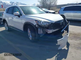 2015 Mazda CX-5 Grand Touring with VIN JM3KE4DY5F0526335, listed as a IAAI auction lot 41756046 with 1 mi miles. Bid and sale history available at carsss.com. Image 1.