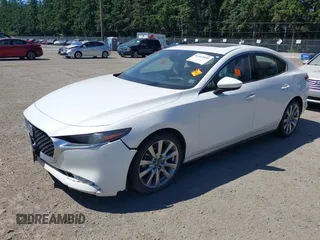 2021 Mazda 3 with VIN JM1BPBDL6M1340029, listed as a IAAI auction lot 42461850 with 79,798 mi miles and . Bid and sale history available at DreamBid. Image 2.