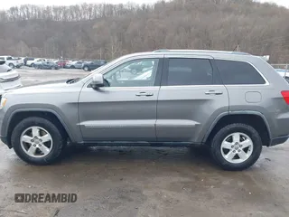 2012 Jeep Grand Cherokee Laredo with VIN 1C4RJFAGXCC118823, listed as a IAAI auction lot 41808398 with 153,509 mi miles. Bid and sale history available at carsss.com. Image 14.
