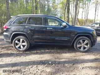 2015 Jeep Grand Cherokee Limited with VIN 1C4RJFBM6FC618650, listed as a IAAI auction lot 42031535 with 133,049 mi miles. Bid and sale history available at carsss.com. Image 13.