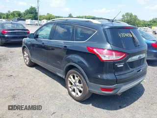 2015 Ford Escape Titanium with VIN 1FMCU9J96FUC01790, listed as a IAAI auction lot 42844336 with 133,005 mi miles and . Bid and sale history available at DreamBid. Image 3.