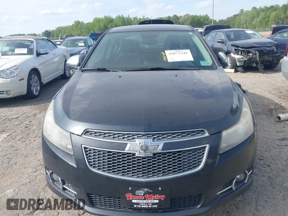 2014 Chevrolet Cruze 2LT z VIN 1G1PE5SB2E7320522, wystawiony jako IAAI lot #42073346 z przebiegiem 116 427 mil mil oraz . Historia ofert i sprzedaży dostępna na DreamBid. Obrazek 12.