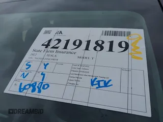 2022 Tesla Model Y Long Range z VIN 7SAYGDEE0NF508958, wystawiony jako IAAI lot #42191819 z przebiegiem 60 880 mil mil oraz . Historia ofert i sprzedaży dostępna na DreamBid. Obrazek 19.