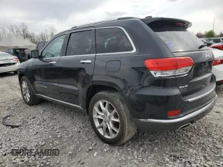 2014 Jeep Grand Cherokee Summit with VIN 1C4RJFJG1EC323658, listed as a Copart auction lot 50740115 with 253,656 mi miles and Salvage title. Bid and sale history available at DreamBid. Image 2.