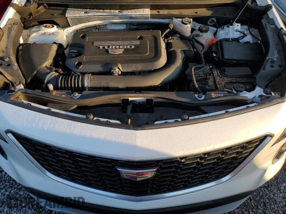 2020 Cadillac XT4 FWD Premium Luxury z VIN 1GYFZCR49LF118146, wystawiony jako Copart lot #82495614 z przebiegiem Nie podano mil oraz Nie do naprawy • Non repairable. Historia ofert i sprzedaży dostępna na DreamBid. Obrazek 12.
