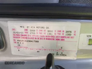 2003 Kia Sedona LX with VIN KNDUP131236417368, listed as a IAAI auction lot 41863624 with 142,896 mi miles. Bid and sale history available at carsss.com. Image 9.