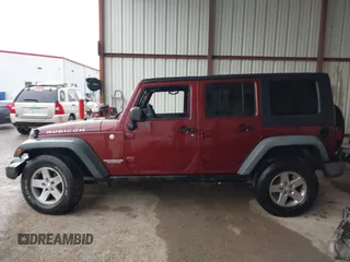 2010 Jeep Wrangler Unlimited Rubicon z VIN 1J4HA6H18AL180628, wystawiony jako IAAI lot #42110357 z przebiegiem 217 940 mil mil oraz . Historia ofert i sprzedaży dostępna na DreamBid. Obrazek 14.