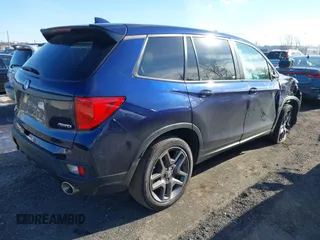 2023 Honda Passport EX-L with VIN 5FNYF8H51PB028045, listed as a IAAI auction lot 41609342 with 52,920 mi miles and . Bid and sale history available at DreamBid. Image 4.