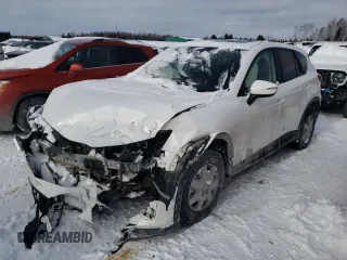 2016 Mazda CX-5 Touring z VIN JM3KE4CY1G0703496, wystawiony jako Copart lot #43806525 z przebiegiem Nie podano mil oraz Szkoda całkowita • Salvage title. Historia ofert i sprzedaży dostępna na DreamBid. Obrazek 1.