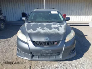 2009 Toyota Matrix S z VIN 2T1LE40E09C006482, wystawiony jako IAAI lot #42624578 z przebiegiem 163 224 mil mil oraz . Historia ofert i sprzedaży dostępna na DreamBid. Obrazek 12.