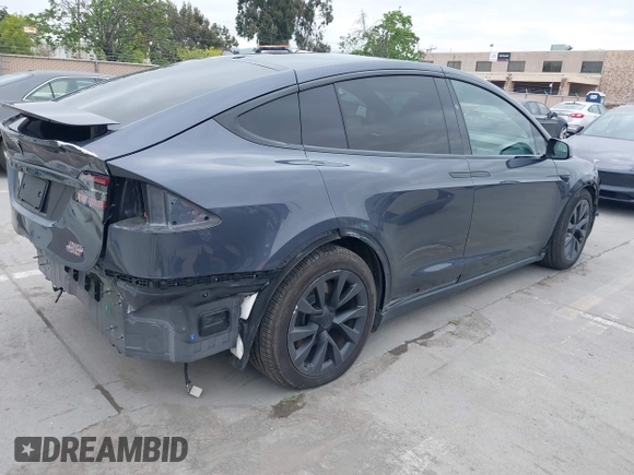 2022 Tesla Model X Plaid with VIN 7SAXCBE6XNF337687, listed as a IAAI auction lot 42035097 with 18,756 mi miles and . Bid and sale history available at DreamBid. Image 4.