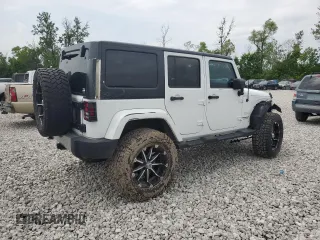 2014 Jeep Wrangler Unlimited Sahara with VIN 1C4BJWEG8EL266340, listed as a Copart auction lot 57809465 with 121,191 mi miles and Salvage title. Bid and sale history available at DreamBid. Image 3.