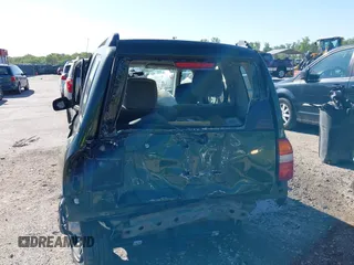 2001 Suzuki Vitara JX z VIN 2S3TD52V416109787, wystawiony jako IAAI lot #42126699 z przebiegiem Nie podano mil oraz . Historia ofert i sprzedaży dostępna na DreamBid. Obrazek 6.