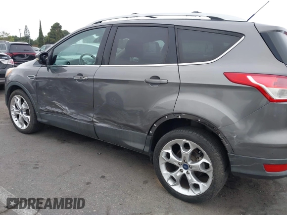 2013 Ford Escape Titanium with VIN 1FMCU0J9XDUD86354, listed as a IAAI auction lot 42420780 with 260,995 mi miles and . Bid and sale history available at DreamBid. Image 6.