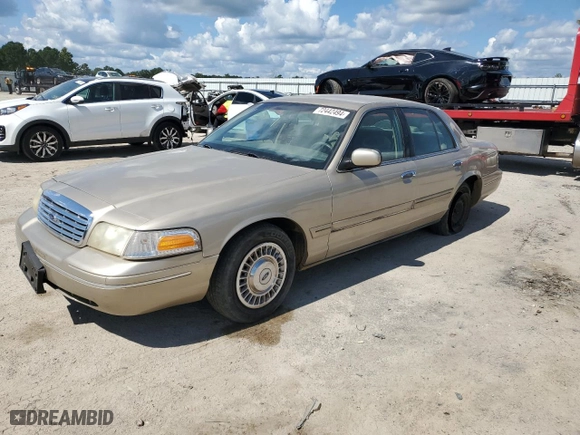 2000 Ford Crown Victoria with VIN 2FAFP73W0YX127395, listed as a Copart auction lot 72442494 with 123,999 mi miles and Salvage Title. Bid and sale history available at carsss.com. Image 1.
