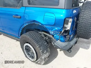 2023 Ford Bronco z VIN 1FMEE5DH6PLB09202, wystawiony jako IAAI lot #41059734 z przebiegiem 30 186 mil mil oraz . Historia ofert i sprzedaży dostępna na DreamBid. Obrazek 6.