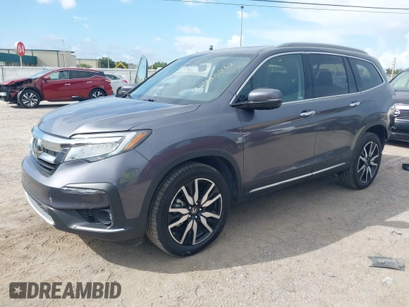 2022 Honda Pilot Elite with VIN 5FNYF6H04NB025212, listed as a IAAI auction lot 42430032 with 69,427 mi miles and . Bid and sale history available at DreamBid. Image 17.
