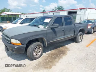 2004 Dodge Dakota SLT z VIN 1D7HG48N34S693877, wystawiony jako IAAI lot #42423197 z przebiegiem 163 141 mil mil oraz . Historia ofert i sprzedaży dostępna na DreamBid. Obrazek 2.