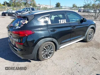 2019 Hyundai Tucson Sport with VIN KM8J33AL5KU902933, listed as a IAAI auction lot 41286316 with 73,799 mi miles. Bid and sale history available at carsss.com. Image 4.
