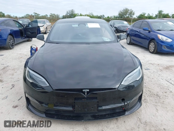 2023 Tesla Model S with VIN 5YJSA1E52PF500088, listed as a IAAI auction lot 41372918 with Not provided miles and . Bid and sale history available at DreamBid. Image 13.
