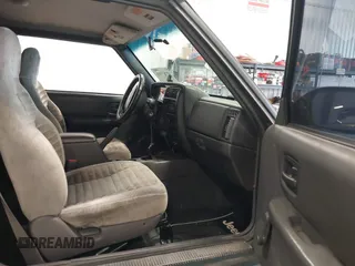 1999 Jeep Cherokee SE z VIN 1J4FF27S0XL575410, wystawiony jako IAAI lot #42787311 z przebiegiem 174 830 mil mil oraz . Historia ofert i sprzedaży dostępna na DreamBid. Obrazek 5.