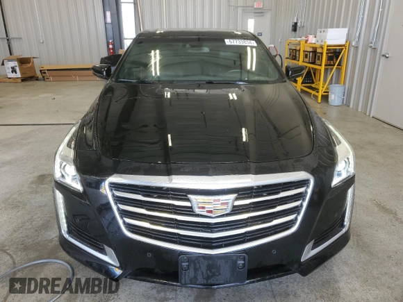 2016 Cadillac CTS Premium Collection AWD with VIN 1G6AZ5SX0G0104289, listed as a Copart auction lot 67733834 with 94,318 mi miles and Salvage title. Bid and sale history available at DreamBid. Image 5.