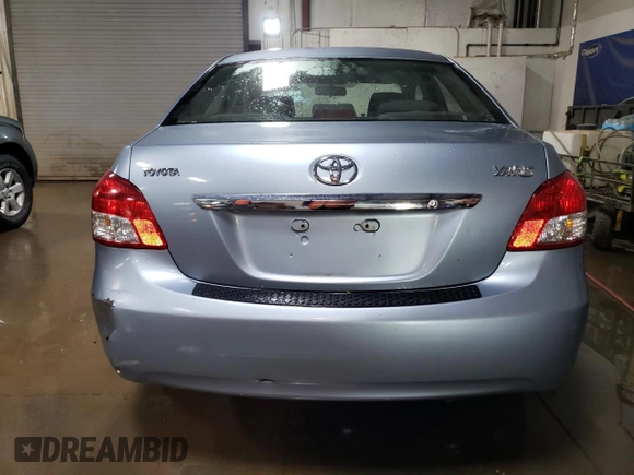 2010 Toyota Yaris with VIN JTDBT4K35A4064446, listed as a Copart auction lot 52099855 with 61,934 mi miles and Salvage Title. Bid and sale history available at carsss.com. Image 6.