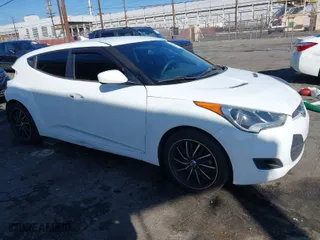 2015 Hyundai Veloster with VIN KMHTC6AD3FU227852, listed as a IAAI auction lot 41657406 with 179,185 mi miles. Bid and sale history available at carsss.com. Image 1.