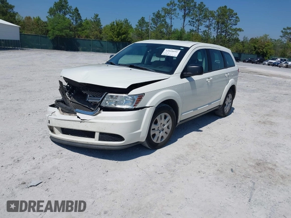 2015 Dodge Journey SE z VIN 3C4PDCAB7FT572716, wystawiony jako IAAI lot #42010091 z przebiegiem 186 489 mil mil oraz . Historia ofert i sprzedaży dostępna na DreamBid. Obrazek 16.