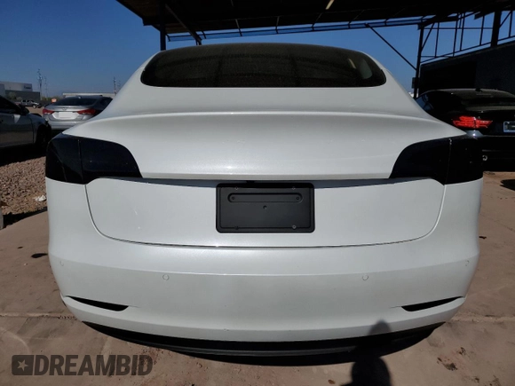 2021 Tesla Model 3 Standard Range Plus with VIN 5YJ3E1EA7MF978749, listed as a Copart auction lot 43377955 with 51,871 mi miles and Salvage Title. Bid and sale history available at carsss.com. Image 6.
