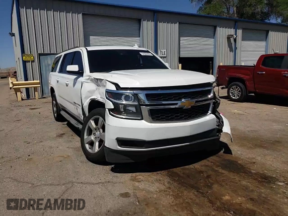 2015 Chevrolet Suburban LT z VIN 1GNSCJKC4FR549967, wystawiony jako Copart lot #57952955 z przebiegiem 311 163 mil mil oraz Szkoda całkowita • Salvage title. Historia ofert i sprzedaży dostępna na DreamBid. Obrazek 14.