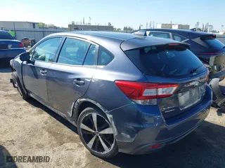 2017 Subaru Impreza Sport with VIN 4S3GTAK61H1731989, listed as a IAAI auction lot 41819366 with 93,369 mi miles. Bid and sale history available at carsss.com. Image 3.