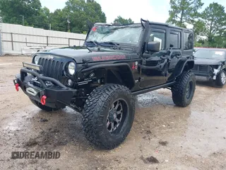 2015 Jeep Wrangler Unlimited Rubicon Hard Rock with VIN 1C4HJWFG0FL674700, listed as a IAAI auction lot 42511949 with 138,370 mi miles and . Bid and sale history available at DreamBid. Image 2.
