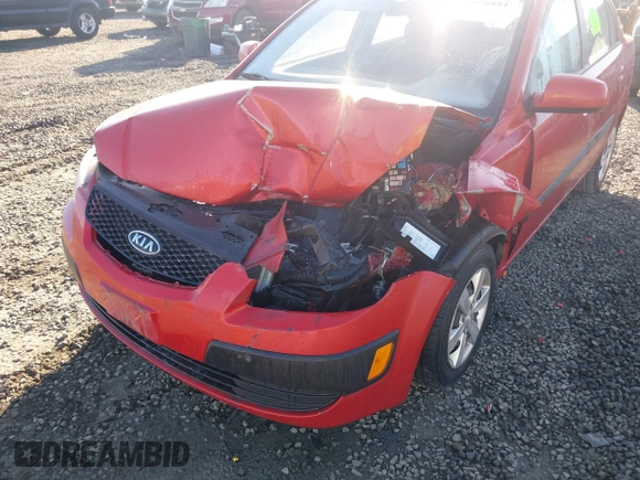 2009 Kia Rio LX with VIN KNADE223796485606, listed as a IAAI auction lot 41676881 with 58,852 mi miles and . Bid and sale history available at DreamBid. Image 6.